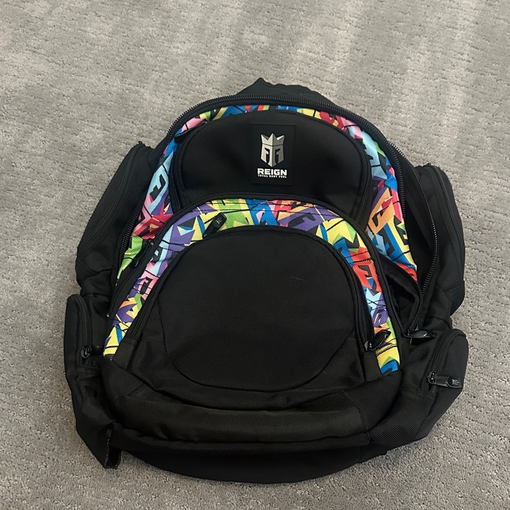 NWOT Reign Black Backpack with Vibrant Multicolor Accents